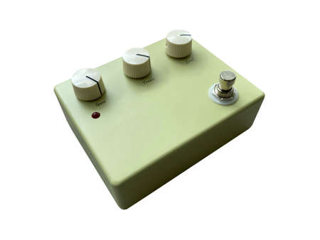 Isolated Vintage cream overdrive and white knob stompbox electric guitar effect on white background . music concept. can use for flat lay graphic or promotion. Side view angle.の写真素材