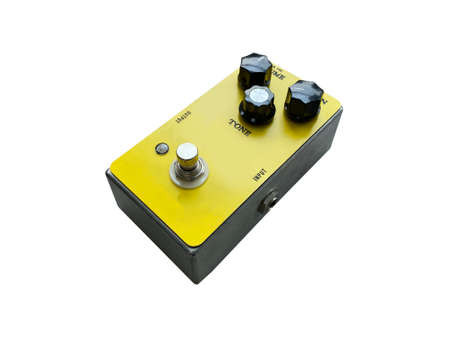 Isolated Yellow overdrive and black knob stompbox electric guitar effect on white background . music concept. can use for flat lay graphic or promotion.の写真素材