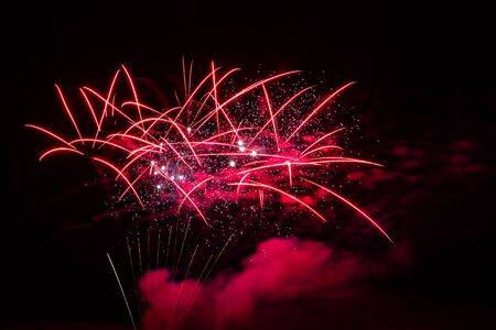 Sparkle fireworks in night sky on Fourth of July Independence day holiday United State of America. Celebration of fun and freedom with sparklers and sparkles.の写真素材