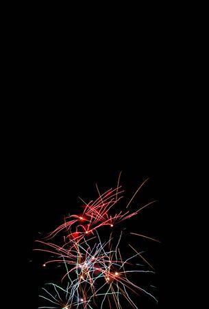 Sparkle fireworks in night sky on Fourth of July Independence day holiday United State of America. Celebration of fun and freedom with sparklers and sparkles.の写真素材