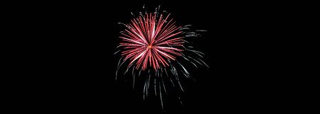 Sparkle fireworks in night sky on Fourth of July Independence day holiday United State of America. Celebration of fun and freedom with sparklers and sparkles.の写真素材