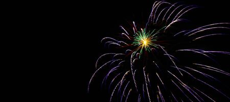 Sparkle fireworks in night sky on Fourth of July Independence day holiday United State of America. Celebration of fun and freedom with sparklers and sparkles.の写真素材