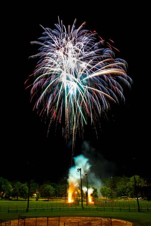 Sparkle fireworks in night sky on Fourth of July Independence day holiday United State of America. Celebration of fun and freedom with sparklers and sparkles.の写真素材