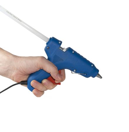Glue pistol in hand の写真素材