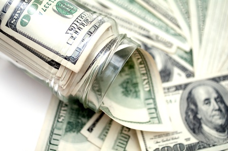 dollars in money jar の写真素材