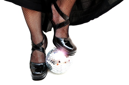 dancers legs with disco ball の写真素材