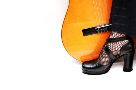 dancers foot with acoustic guitarの写真素材