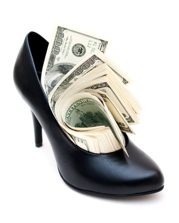 Dollar bills in a elegant leather woman shoeの写真素材