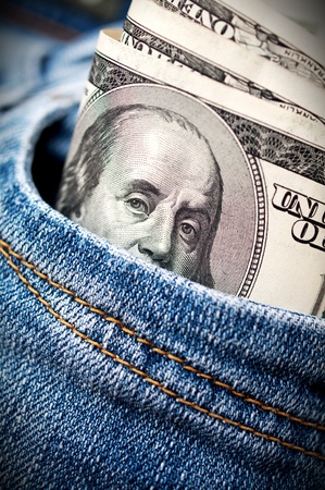 dollar bills  in a blue jeans pocketの写真素材