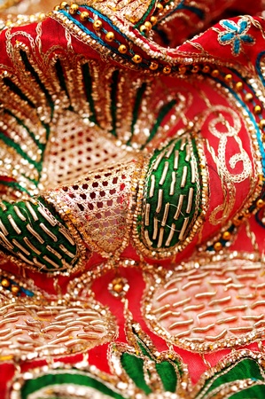 golden red sequin embroidery with silky fabricの写真素材