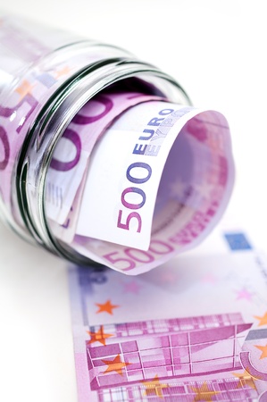 euro banknotes in money jarの写真素材