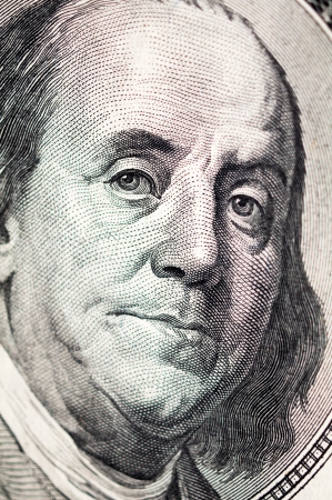 Benjamin Franklin face on one hundred dollar billの写真素材