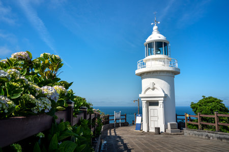 Udo (Cow Island), Jeju island, South Korea - Jun. 06, 2023: Beautiful Udo Lighthouse at Udobong peak (Udo mountain) beside Jeju do (Jeju island).のeditorial素材