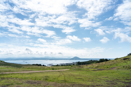 Udo (Cow Island), Jeju island, South Korea - Jun. 06, 2023: Beautiful Udobong peak (Udo mountain) beside Jeju do (Jeju island).のeditorial素材