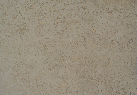 decorative grain plaster with a chaotic pattern of etched lines and swirlsの写真素材