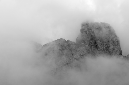 Mountain top on Marmolada glacier with cloudsの写真素材
