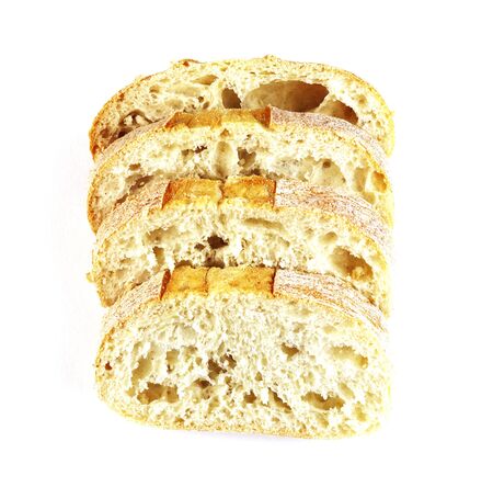 rectangular loaf of bread isolated on a white background, top view. baguette of whole and cut breadの写真素材