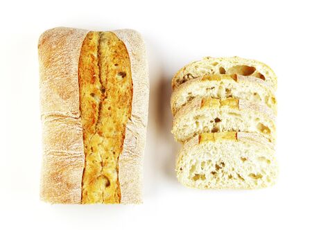 rectangular loaf of bread isolated on a white background, top view. baguette of whole and cut breadの写真素材