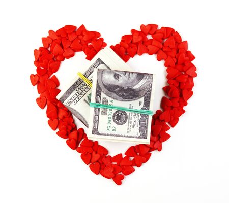 lots of little red hearts on a white background. hearts in the form of a large heart. the money inside the heart. background for Valentine's Dayの写真素材
