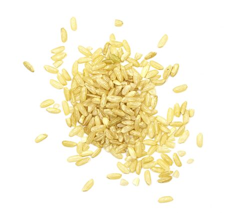 a pile of brown rice isolated on a white background, top view. unpolished white rice for health. culinary dish for diabetes treatmentの写真素材