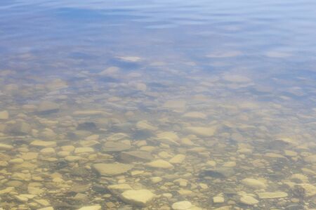 Beautiful underwater rocks on the seashore. crystal clear clear water with a translucent bottomの写真素材