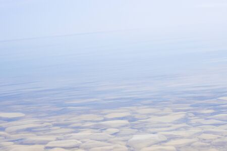 Beautiful underwater rocks on the seashore. crystal clear clear water with a translucent bottomの写真素材