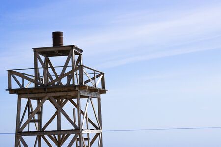 Wooden watchtower. the ancient wooden structure for the review and warning about the dangers ofの写真素材
