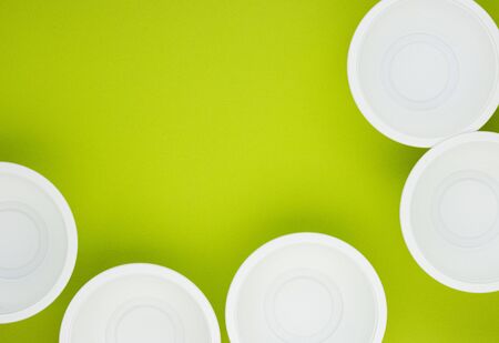 biodegradable food containers on a green background, space for text. caring for nature. reducing environmental pollution. refusal of plastic dishesの写真素材