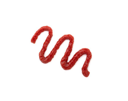 a strip of red ketchup isolated on a white background. tomato sauce for spilled on a white surfaceの写真素材