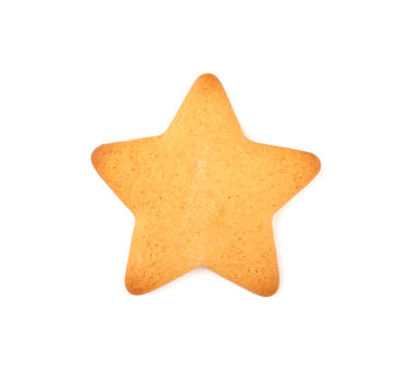 Christmas gingerbread in the shape of a star, isolated on a white background. festive treats for Christmas and new year. Christmas tree decorationの写真素材