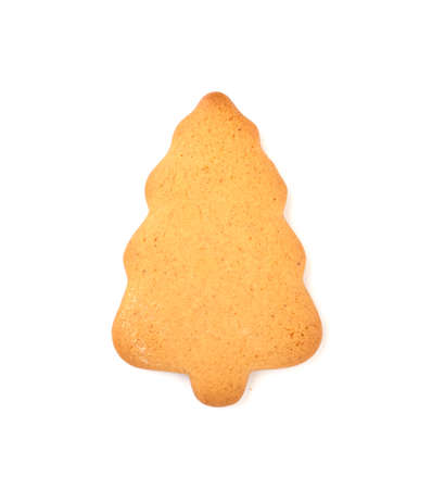 Christmas gingerbread in the shape of a Christmas tree, isolated on a white background. festive treats for Christmas and new yearの写真素材