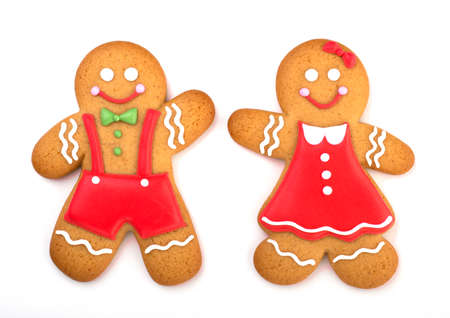 happy gingerbread man covered in icing isolated on a white background. Festive treats for new year...