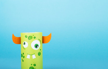 Paper monsters on a blue background. Handmade concept, creative idea from toilet tube, recyclingの写真素材