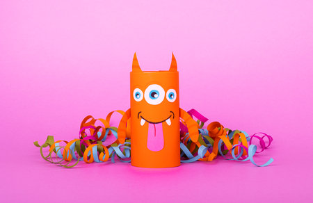 Collection of toilet tube monsters on purple background for Halloween decor. Creative idea of...