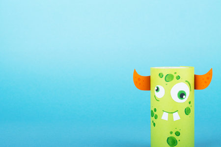 Collection of toilet tube monsters on purple background for Halloween decor. Creative idea of handworkの写真素材