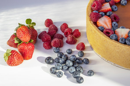 strawberry and blueberry raspberry dessert. home-made cheesecake