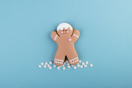 gingerbread man with a mask on his face. Creative carrot in the concept of the syndrome COVID-19の写真素材