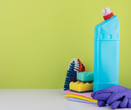 cleaning products on a green background with space for text. the concept of cleaning and cleanlinessの写真素材