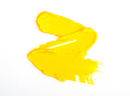 a smear of yellow paint isolated on a white background. yellow for 2021の写真素材
