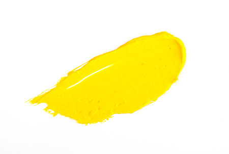 a smear of yellow paint isolated on a white background. yellow for 2021の写真素材
