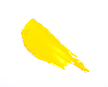Illuminating  2021 yellow smear of oil paint on a white background. traces of yellow paintの写真素材