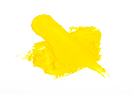 Illuminating  2021 yellow smear of oil paint on a white background. traces of yellow paintの写真素材