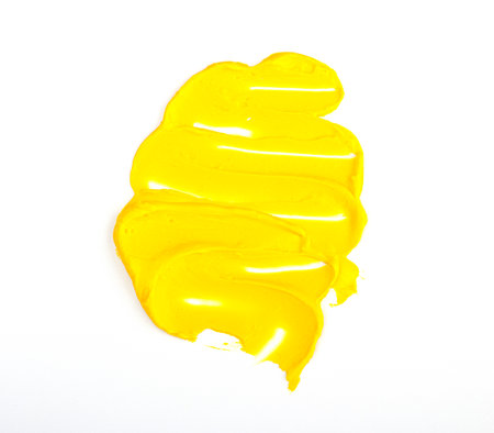 Illuminating  2021 yellow smear of oil paint on a white background. traces of yellow paintの写真素材