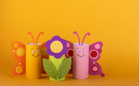 cute paper butterfly made from a toilet paper tube. spring background. recyclingの写真素材