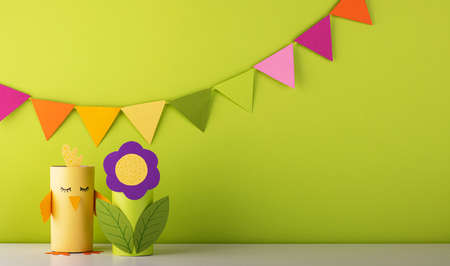 beautiful paper flower with cute handmade birds on green background. fresh spring and summer backgroundの写真素材