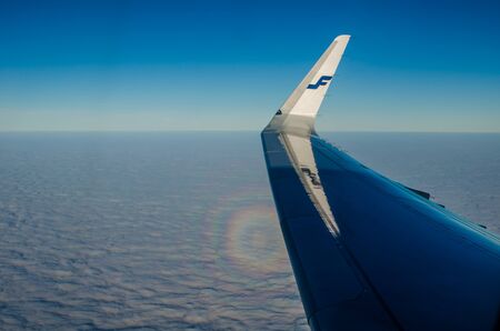 sky and clouds from the window of the plane altitude flight flight freedomの写真素材