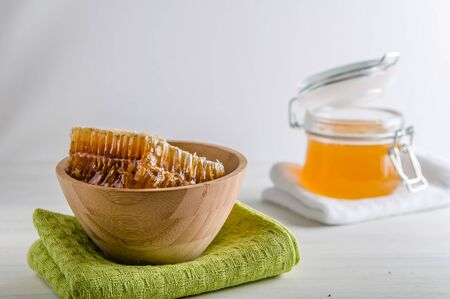 fresh honey and honeyons on a white backgroundの写真素材