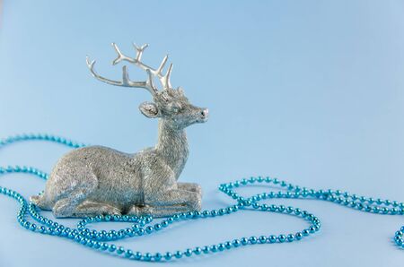 New Year's, christmas background. silver deer on a blue background. Copy spaceの写真素材