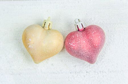 Christmas tree balls red and golden heart on a white backgroundの写真素材