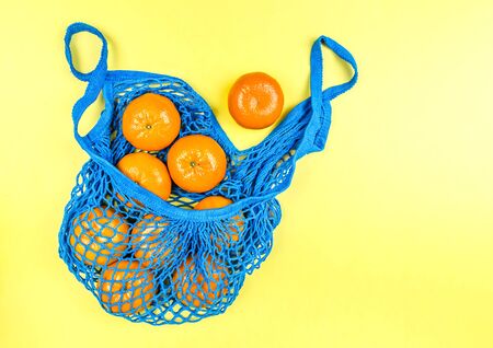 concept no plastic. oranges in a blue mesh bag. free plasticの写真素材